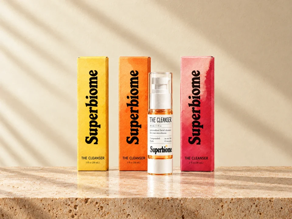 The three Skin Nutrients Cleanser boxes in yellow, orange and red, with one bottle